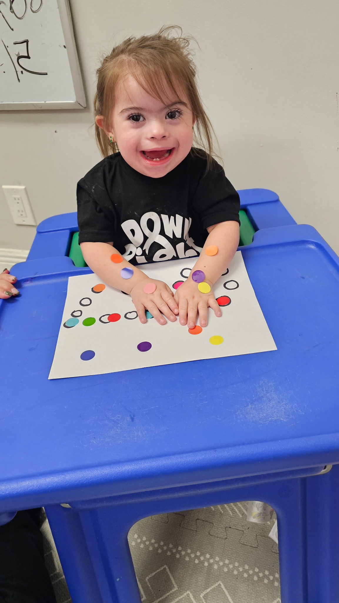 A participant enjoying a Pom-Pom's Players activity